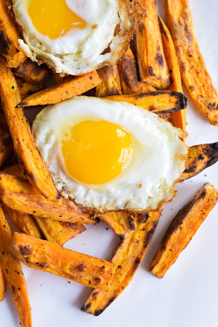 Baked Loaded Sweet Potato Breakfast Fries topped with sunny side up eggs, bacon, avocados and cotija cheese are sure to be your new favorite weekend breakfast.