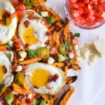 Baked Loaded Sweet Potato Breakfast Fries topped with sunny side up eggs, bacon, avocados and cotija cheese are sure to be your new favorite weekend breakfast.