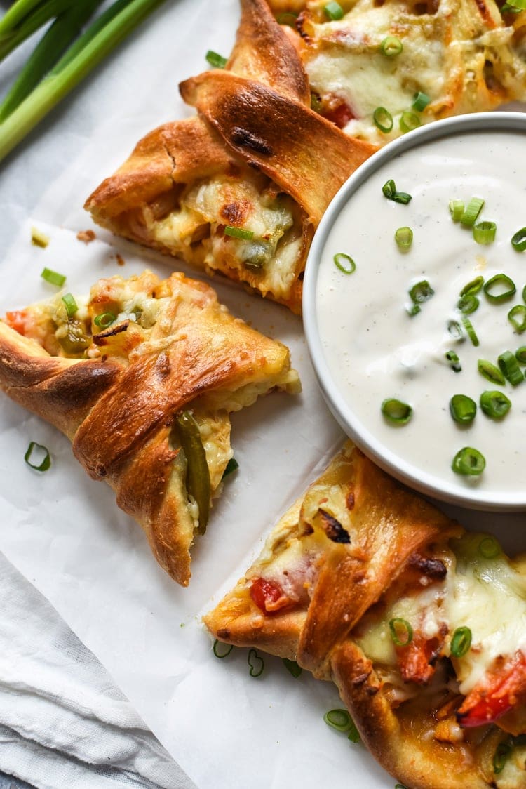 This easy Buffalo Chicken Fajita Pizza Ring is the perfect game day appetizer for parties and get-togethers. By the end of the night, everyone will be asking for the recipe!