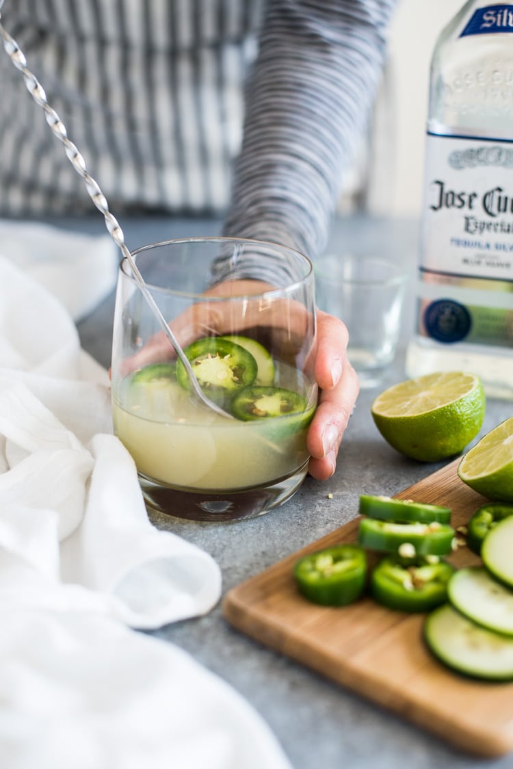 A Cucumber Jalapeno Margarita made with refreshing cucumber sparkling water, fresh jalapeños and organic agave nectar because it's 5 o'clock somewhere!