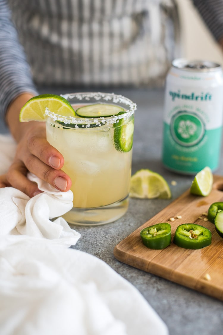 A Cucumber Jalapeno Margarita made with refreshing cucumber sparkling water, fresh jalapeños and organic agave nectar because it's 5 o'clock somewhere!