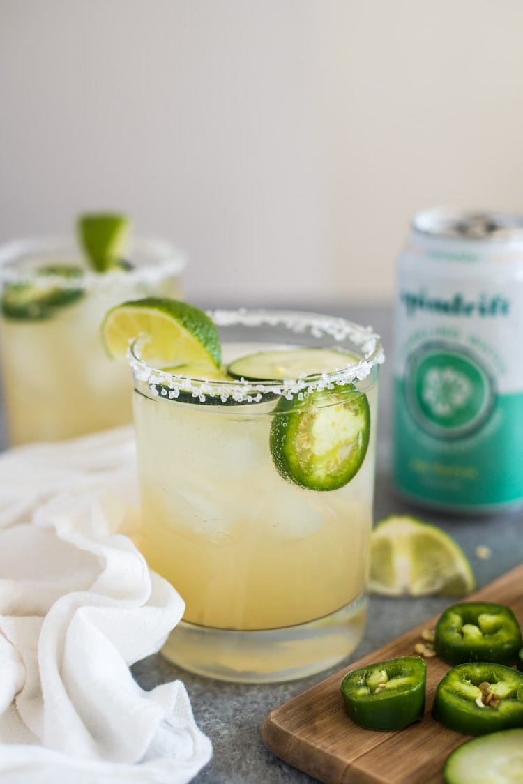 A Cucumber Jalapeno Margarita made with refreshing cucumber sparkling water, fresh jalapeños and organic agave nectar because it's 5 o'clock somewhere!