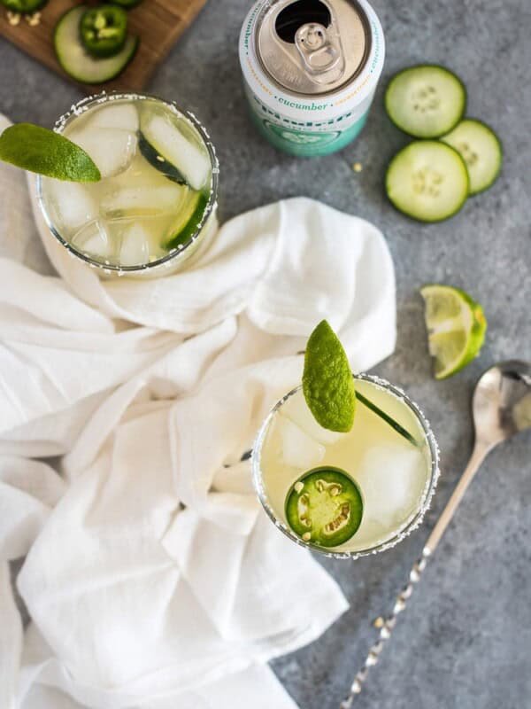 A Cucumber Jalapeno Margarita made with refreshing cucumber sparkling water, fresh jalapeños and organic agave nectar because it's 5 o'clock somewhere!