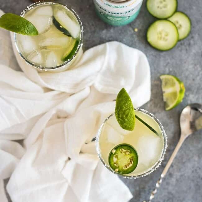 A Cucumber Jalapeno Margarita made with refreshing cucumber sparkling water, fresh jalapeños and organic agave nectar because it's 5 o'clock somewhere!