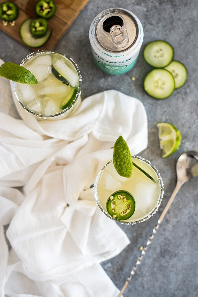 A Cucumber Jalapeno Margarita made with refreshing cucumber sparkling water, fresh jalapeños and organic agave nectar because it's 5 o'clock somewhere!