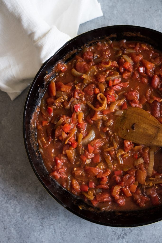 shakshuka sauce being cooked in a pan