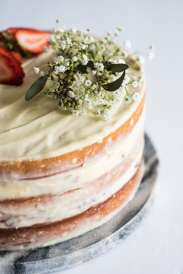 This Homemade Yellow Cake with Vanilla Cream Cheese Frosting is a rich and buttery layered "naked cake" perfect for any celebration!