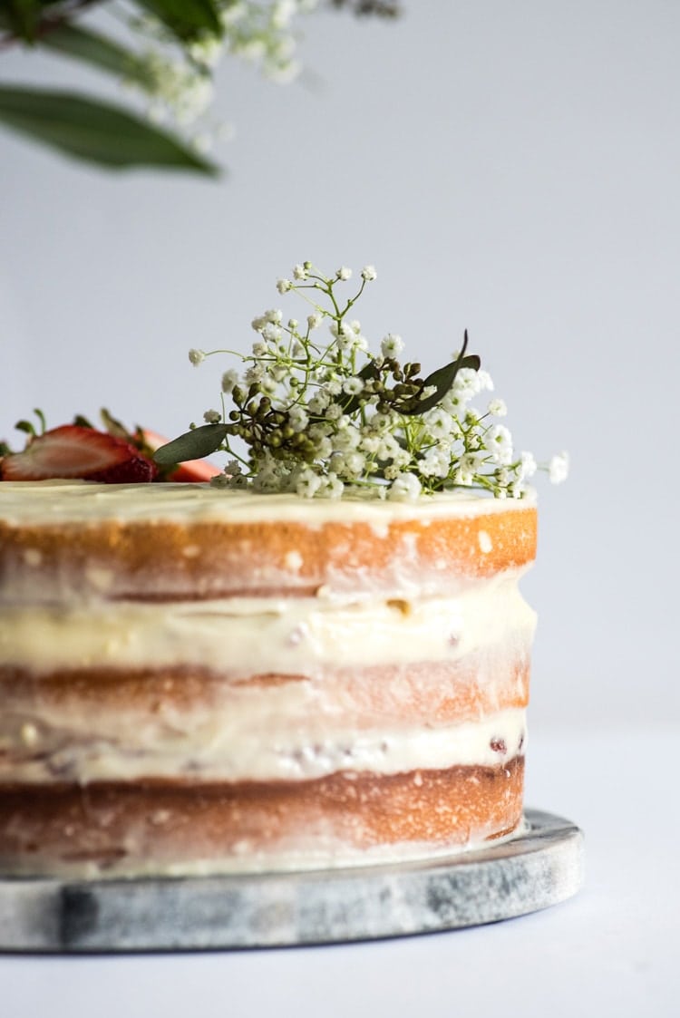 This Homemade Yellow Cake with Vanilla Cream Cheese Frosting is a rich and buttery layered "naked cake" perfect for any celebration!