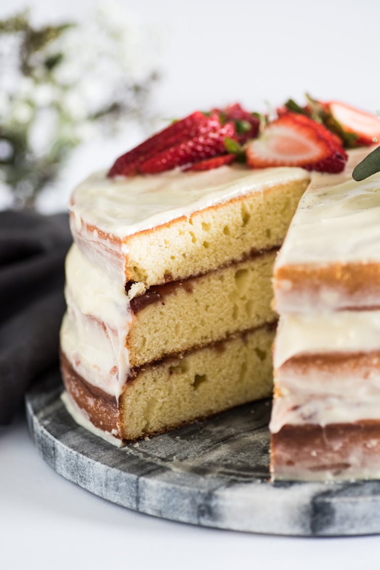 This Homemade Yellow Cake with Vanilla Cream Cheese Frosting is a rich and buttery layered "naked cake" perfect for any celebration!