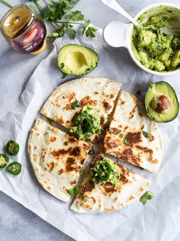 Seasoned with honey, garlic, lime juice and jalapeños, this Jalapeño Chicken Quesadilla topped with Honey Guacamole takes lunchtime to a whole new level.