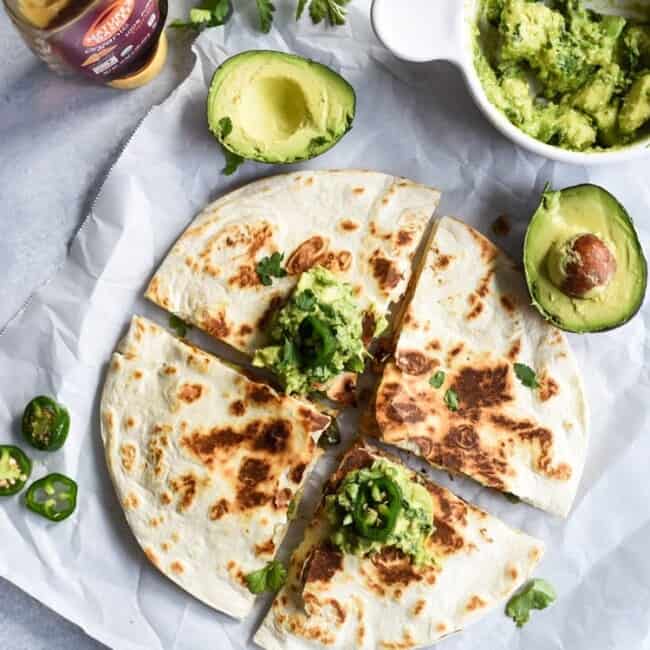 Seasoned with honey, garlic, lime juice and jalapeños, this Jalapeño Chicken Quesadilla topped with Honey Guacamole takes lunchtime to a whole new level.