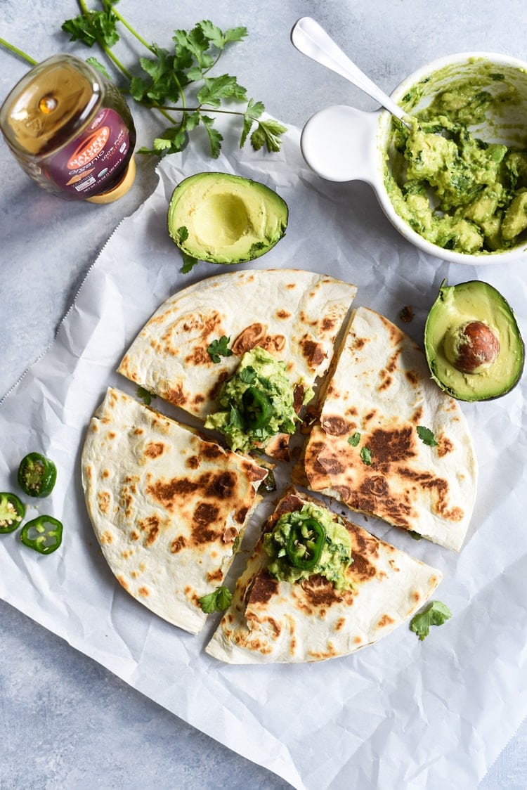 Seasoned with honey, garlic, lime juice and jalapeños, this Jalapeño Chicken Quesadilla topped with Honey Guacamole takes lunchtime to a whole new level.