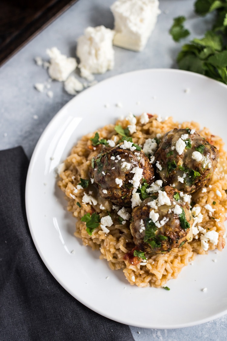 These Mexican Turkey Meatballs made with cilantro, garlic and a packet of taco seasoning are a great appetizer or weeknight meal when served with Arroz Verde (green chile rice).