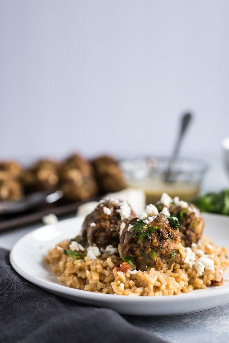 These Mexican Turkey Meatballs made with cilantro, garlic and a packet of taco seasoning are a great appetizer or weeknight meal when served with Arroz Verde (green chile rice).