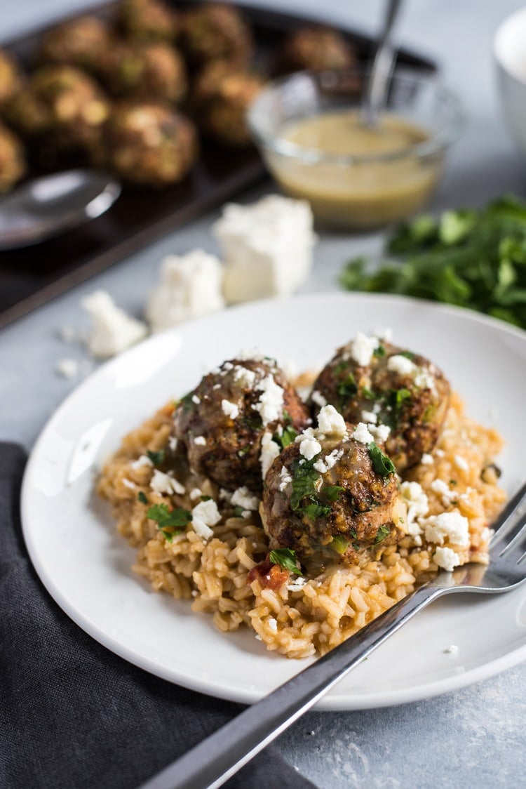 These Mexican Turkey Meatballs made with cilantro, garlic and a packet of taco seasoning are a great appetizer or weeknight meal when served with Arroz Verde (green chile rice).