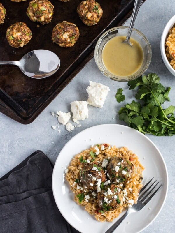 These Mexican Turkey Meatballs made with cilantro, garlic and a packet of taco seasoning are a great appetizer or weeknight meal when served with Arroz Verde.