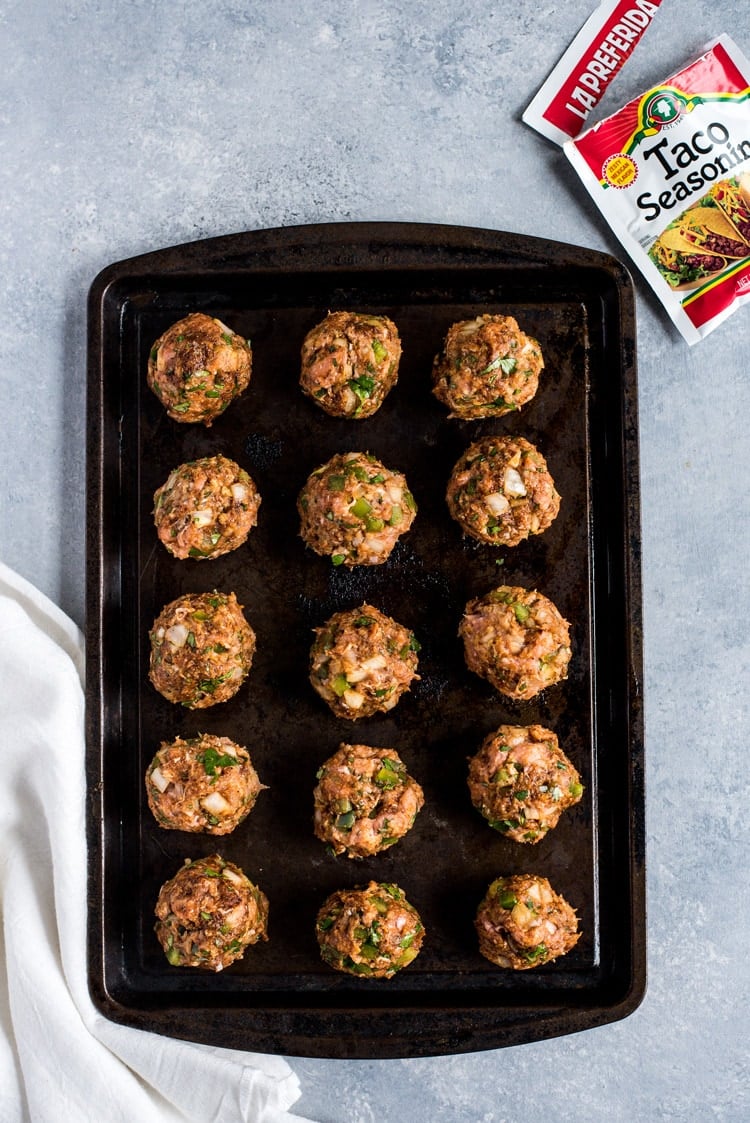 These Mexican Turkey Meatballs made with cilantro, garlic and a packet of taco seasoning are a great appetizer or weeknight meal when served with Arroz Verde (green chile rice).
