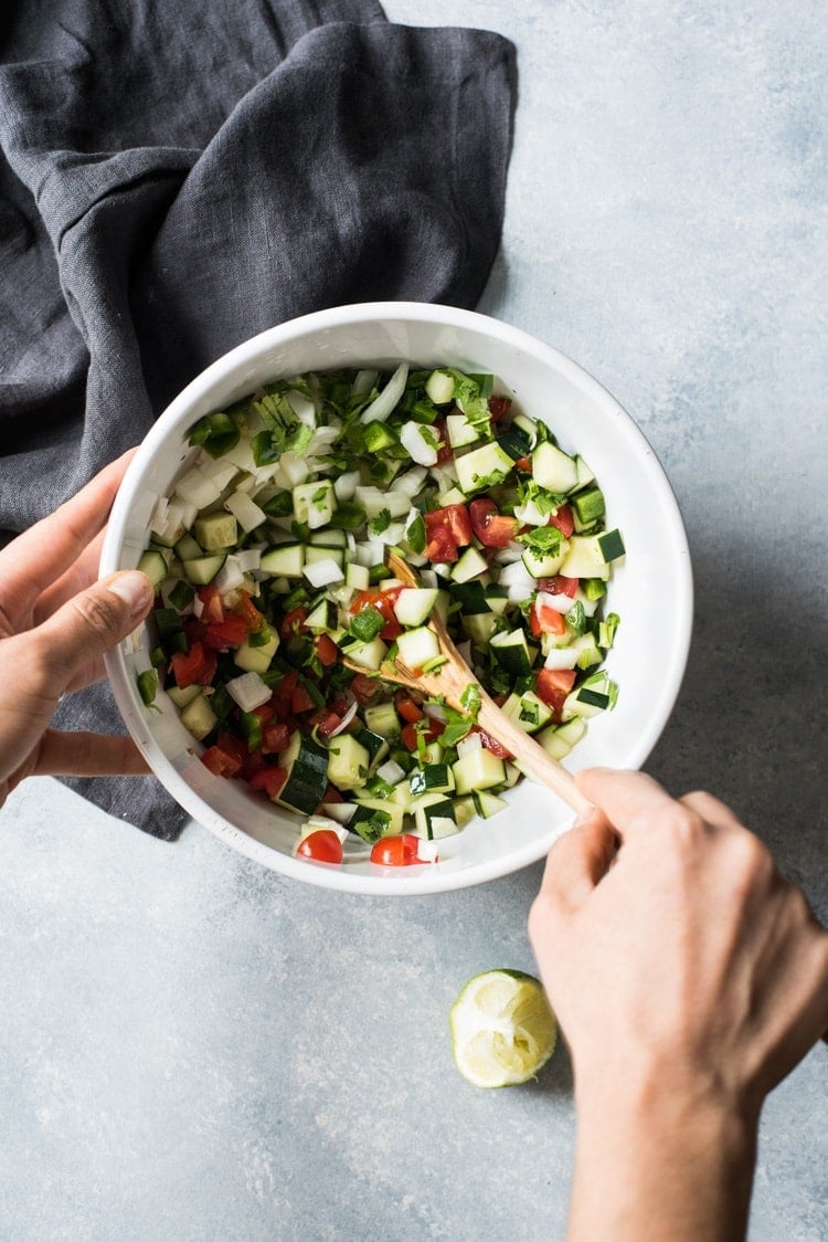 This Fresh Cucumber Salsa is quick and easy to make! Ready in only 15 minutes, this healthy salsa is the perfect topping for tacos, enchiladas and grilled meats.