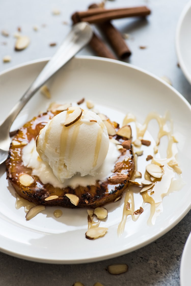 This No Churn Coconut Ice Cream is smooth, creamy and made with only 2 ingredients! Served with ponche roasted pineapples, it's perfect for hot summer days.