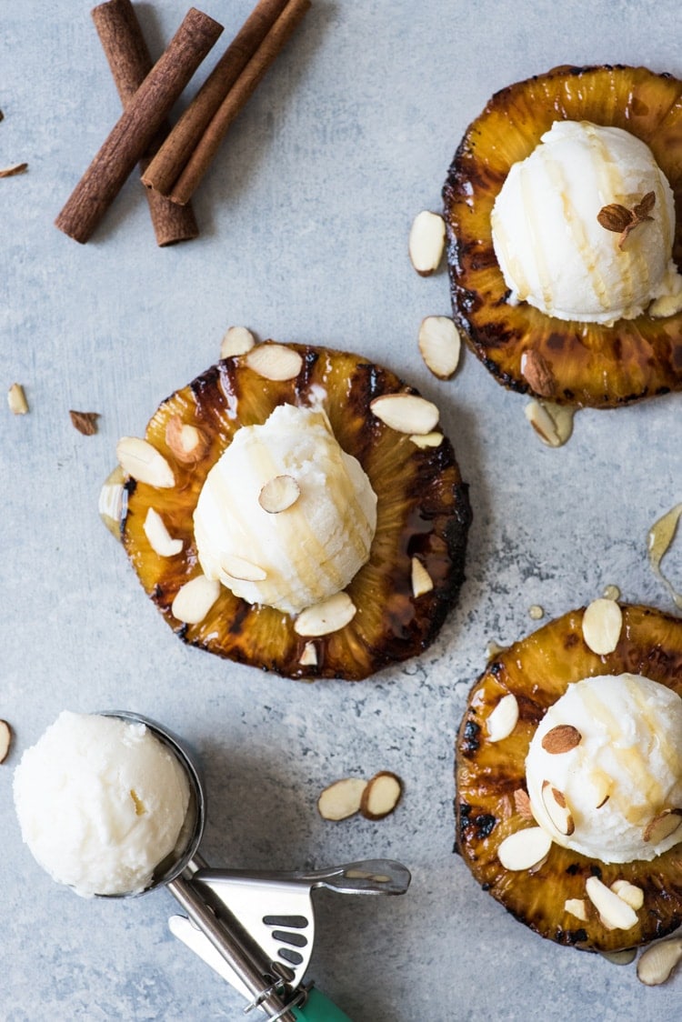 This No Churn Coconut Ice Cream is smooth, creamy and made with only 2 ingredients! Served with ponche roasted pineapples, it's perfect for hot summer days.
