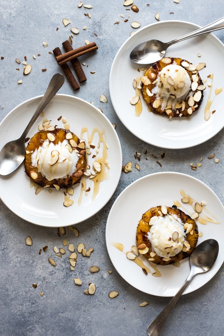 This No Churn Coconut Ice Cream is smooth, creamy and made with only 2 ingredients! Served with ponche roasted pineapples, it's perfect for hot summer days.