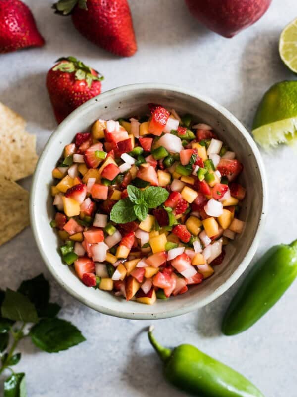 This Peach Strawberry Salsa is super fresh, sweet yet savory and tastes great with chips and salsa. Also makes a great topping for tacos, salads and grilled meats! 
