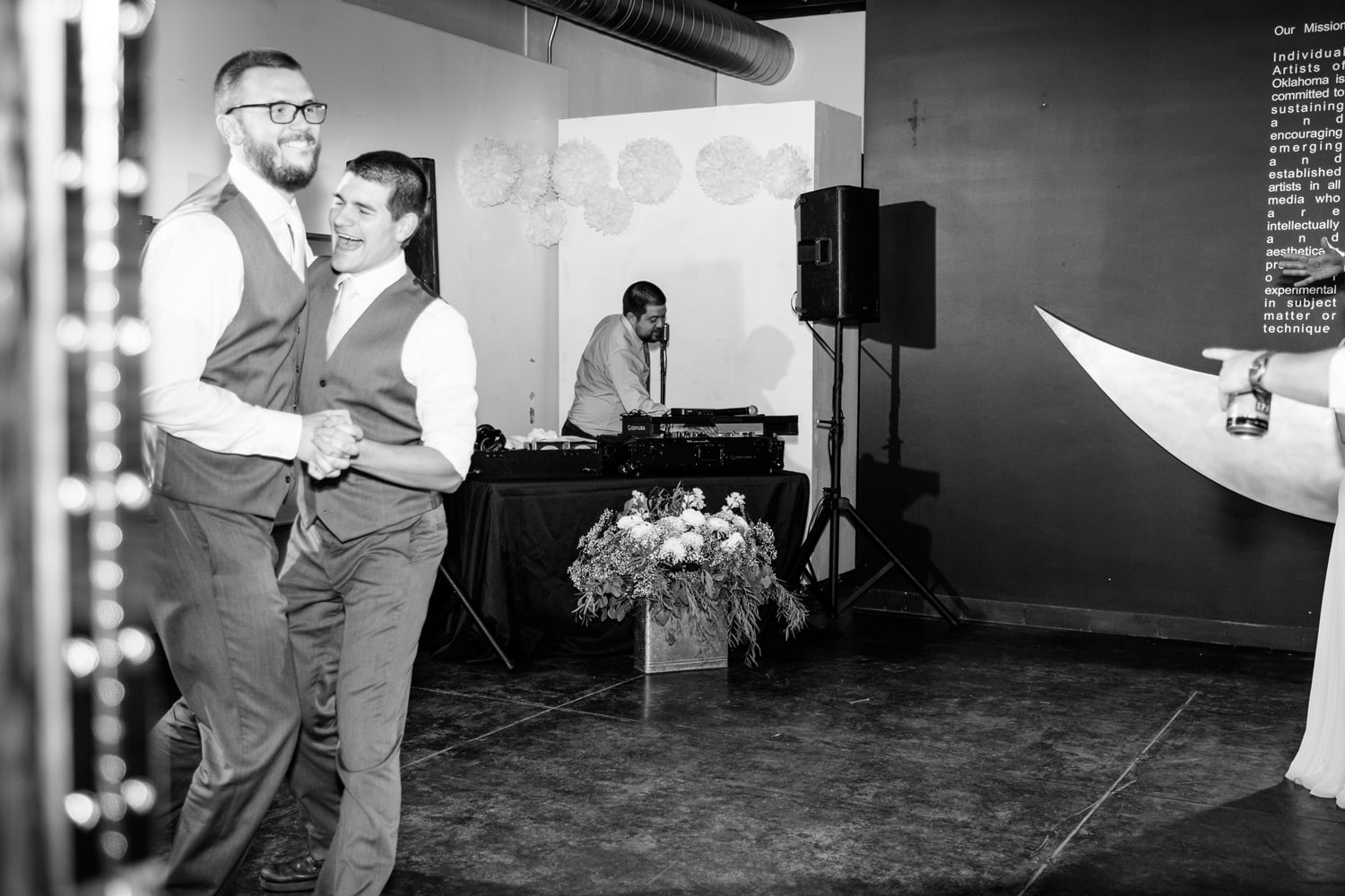 DJ Connection dancing at John Moore and Isabel Orozco Moore wedding at IAO Gallery in Oklahoma City // Photo by Leia Smethurst Photography