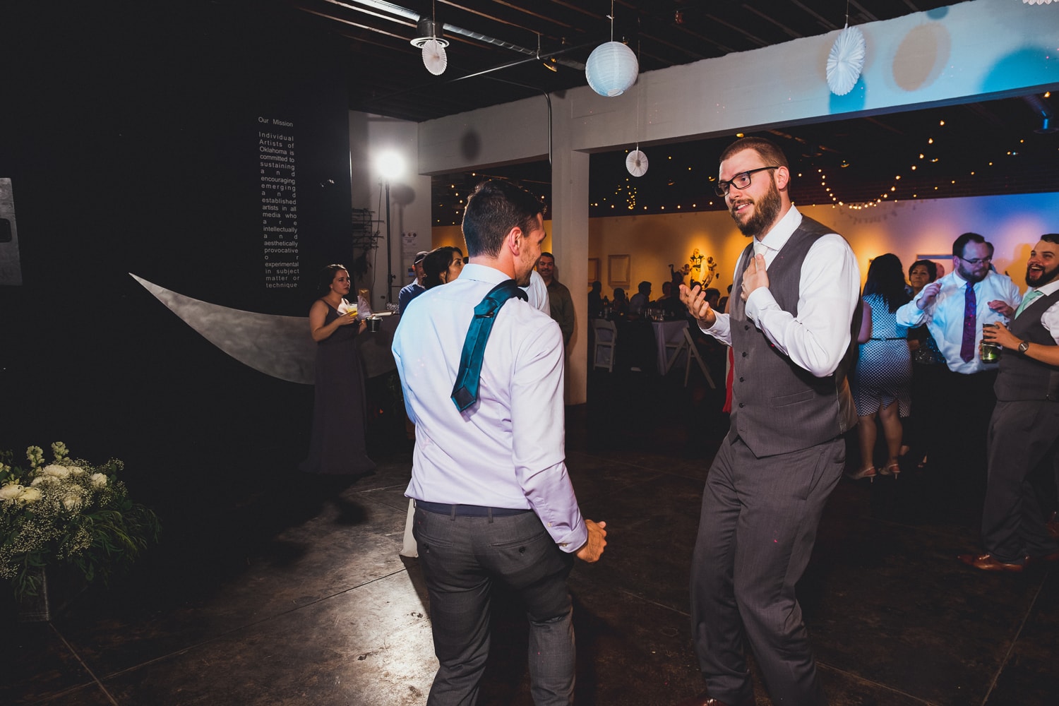 DJ Connection dancing at John Moore and Isabel Orozco Moore wedding at IAO Gallery in Oklahoma City // Photo by Leia Smethurst Photography