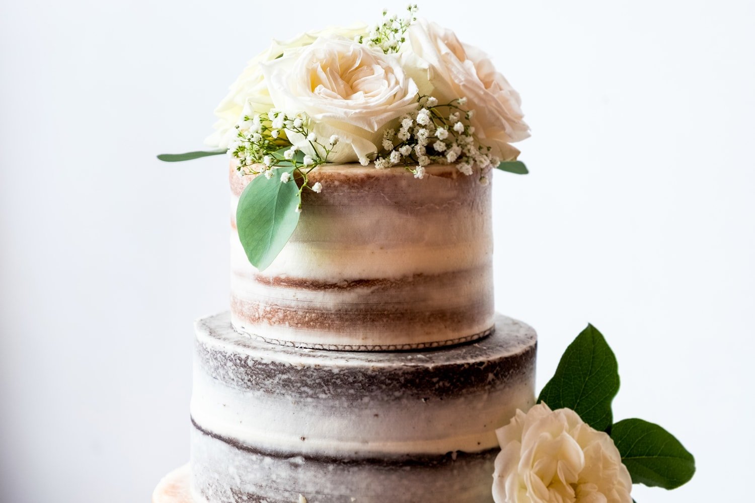 Stacie's Cake naked wedding cake at John Moore and Isabel Orozco Moore wedding at IAO Gallery in Oklahoma City // Photo by Leia Smethurst Photography