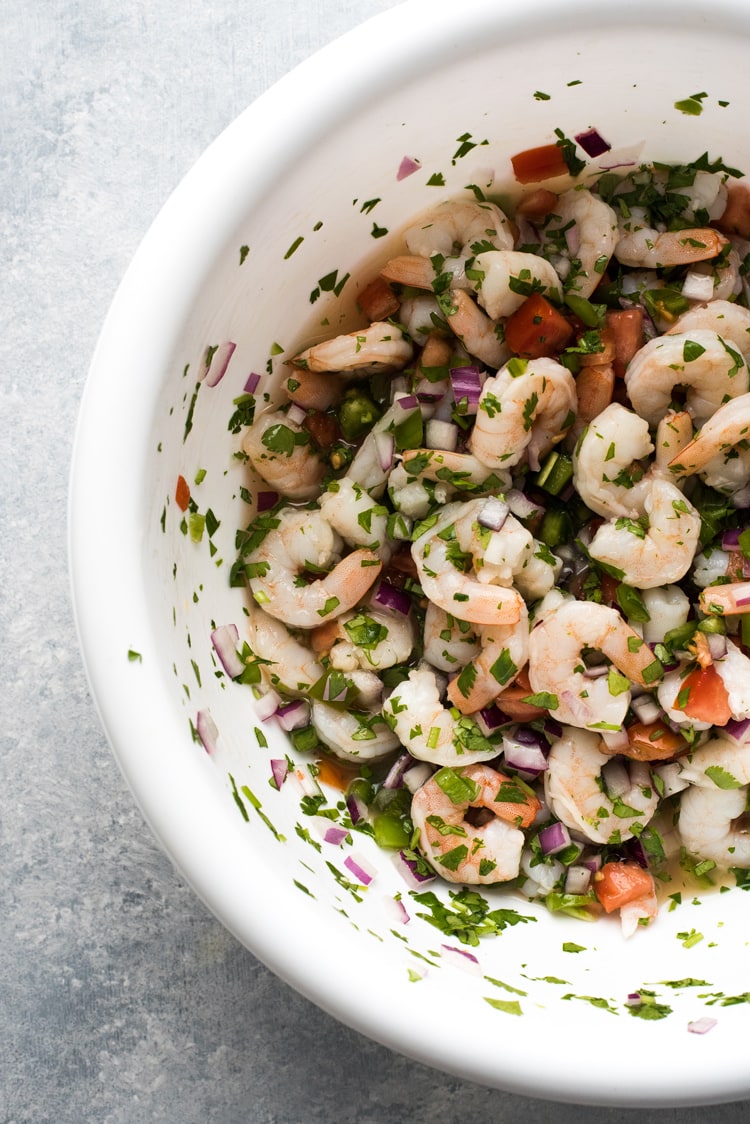 This easy, light and refreshing Mexican Ceviche Rice Bowl is the perfect summer meal made from citrus marinated shrimp, tomatoes, onions, jalapenos and cilantro.