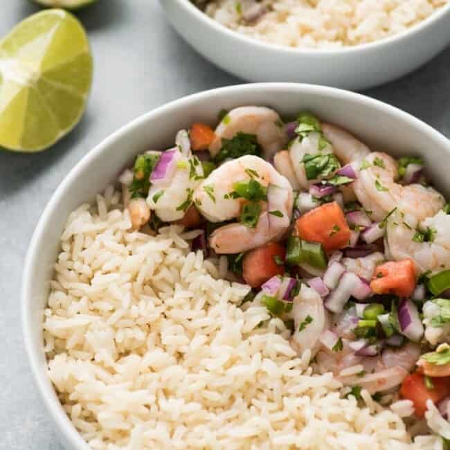 This easy, light and refreshing Mexican Ceviche Rice Bowl is the perfect summer meal made from citrus marinated shrimp, tomatoes, onions, jalapenos and cilantro.