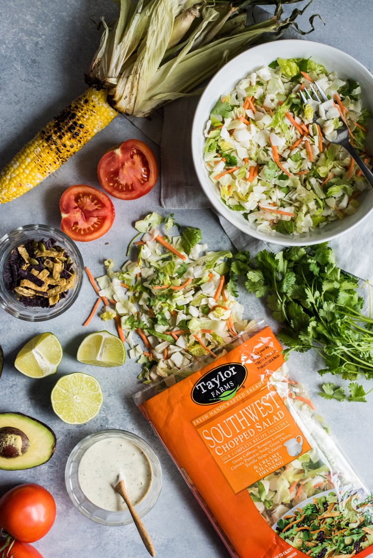 A bright, fresh Mexican Chimichurri Chicken Salad featuring grilled corn, summer tomatoes, marinated and grilled chimichurri chicken and creamy avocados. (gluten free)