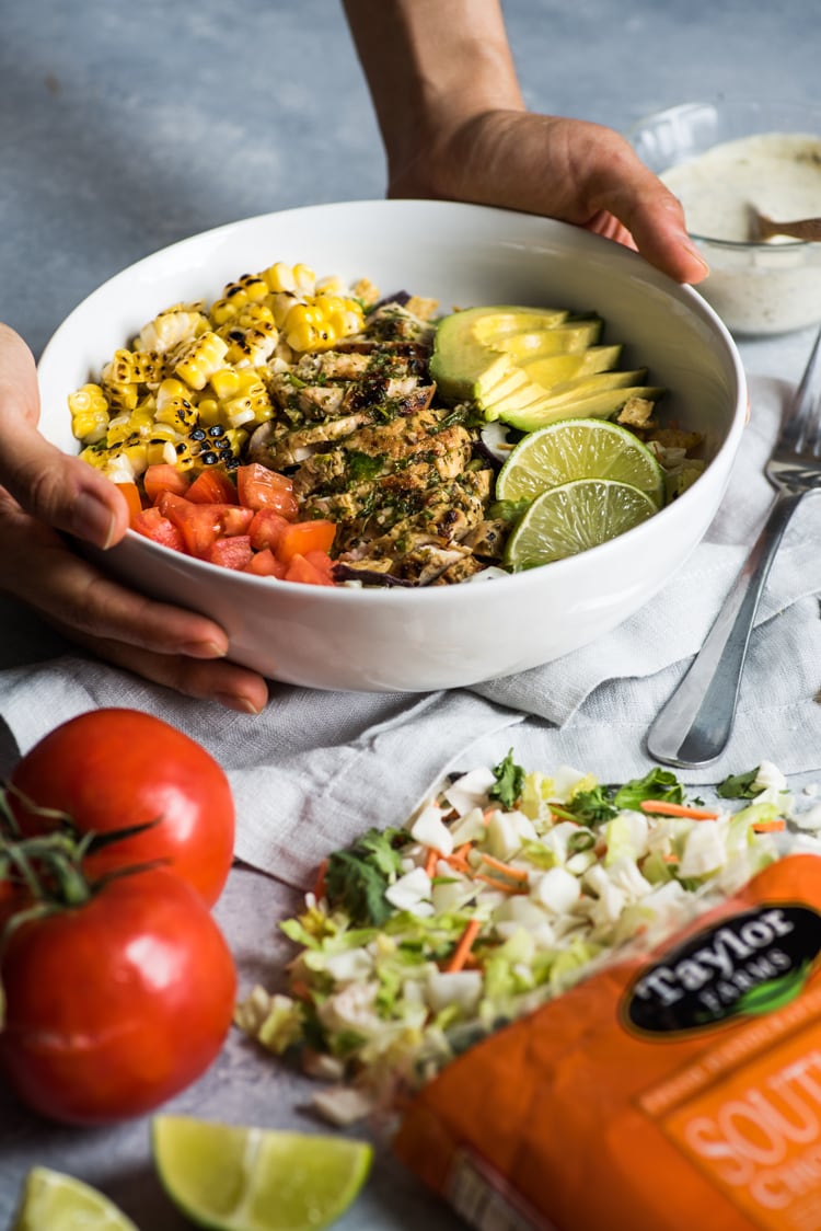 A bright, fresh Mexican Chimichurri Chicken Salad featuring grilled corn, summer tomatoes, marinated and grilled chimichurri chicken and creamy avocados. (gluten free)