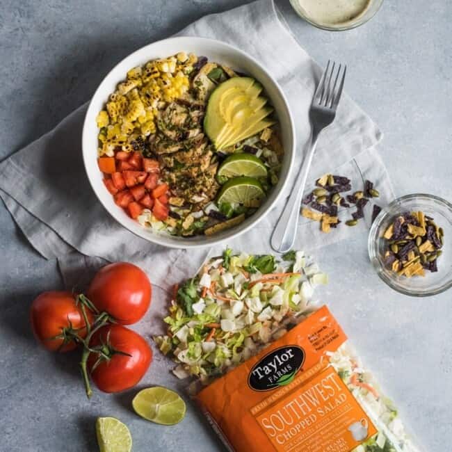 A bright, fresh Mexican Chimichurri Chicken Salad featuring grilled corn, summer tomatoes, marinated and grilled chimichurri chicken and creamy avocados. (gluten free)