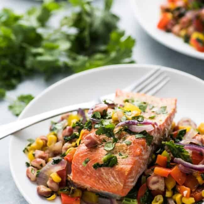 This Roasted Adobo Salmon with Rainbow Vegetable Stir Fry is packed with tons of protein and veggies that's perfect for any weeknight meal! (gluten free)