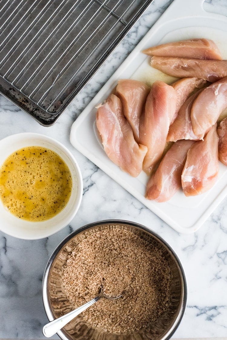 These Crispy Oven Baked Chicken Tenders seasoned with garlic, paprika and chili powder are made without the excess oil, making them a healthy meal option!