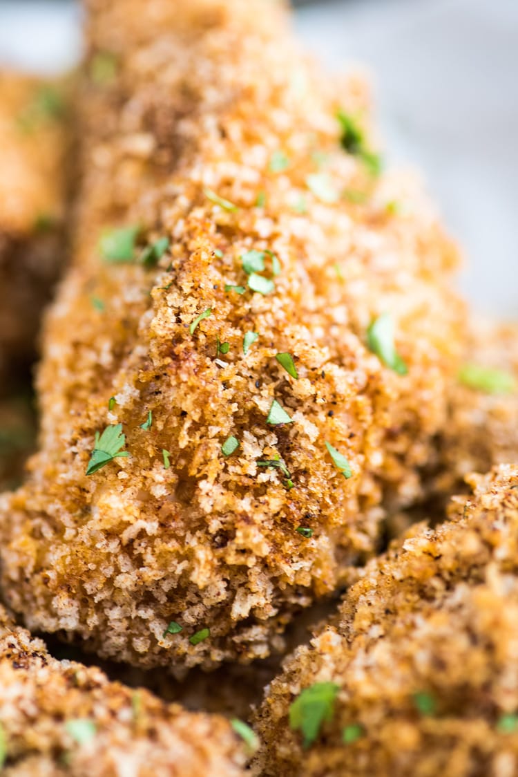 These Crispy Oven Baked Chicken Tenders seasoned with garlic, paprika and chili powder are made without the excess oil, making them a healthy meal option!