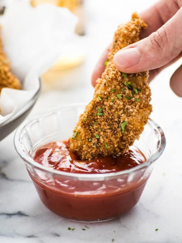 These Crispy Oven Baked Chicken Tenders seasoned with garlic, paprika and chili powder are made without the excess oil, making them a healthy meal option!