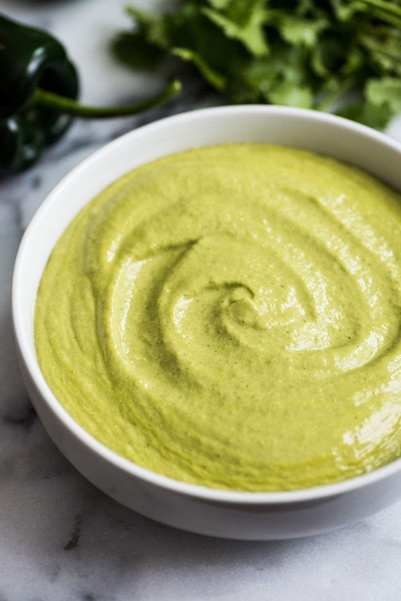 A Mexican favorite, this Easy Roasted Poblano Cream Sauce is loaded with flavor and goes well on tacos, burritos, enchiladas and more! (gluten free)