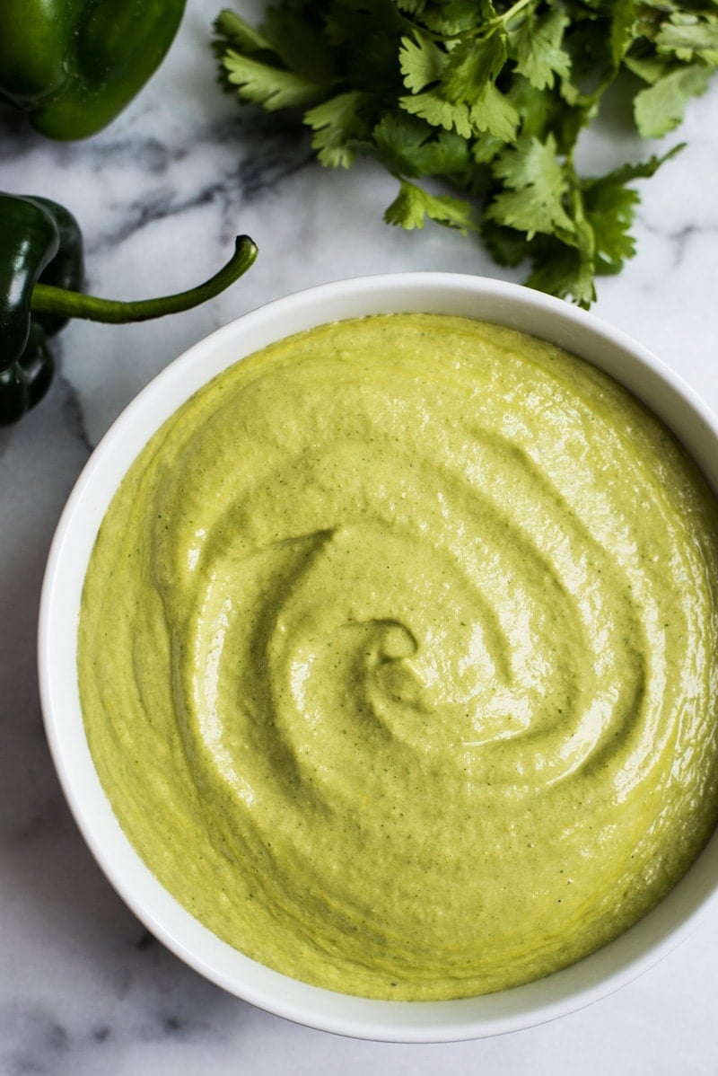 A Mexican favorite, this Easy Roasted Poblano Cream Sauce is loaded with flavor and goes well on tacos, burritos, enchiladas and more! (gluten free)