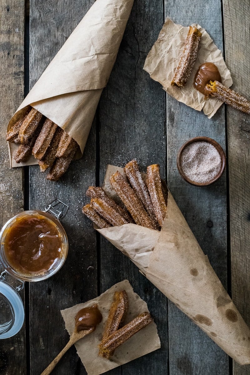 Baked Pumpkin Churros covered in cinnamon sugar are the perfect fall and winter dessert. They're baked, not fried, which means you can eat more of them!