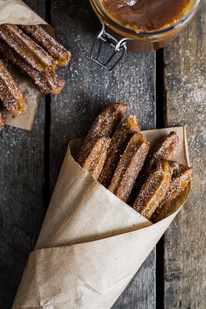 Baked Pumpkin Churros covered in cinnamon sugar are the perfect fall and winter dessert. They're baked, not fried, which means you can eat more of them!