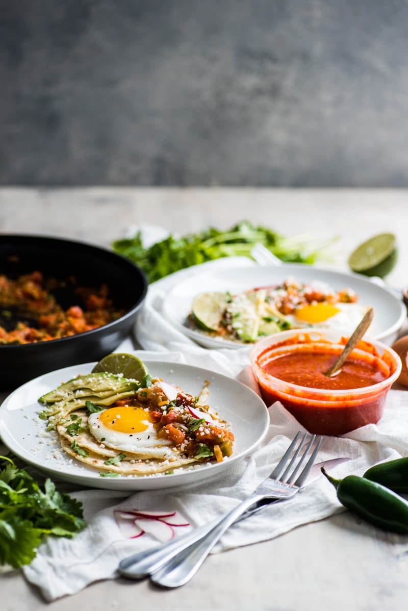 This Easy Huevos Rancheros recipe features crispy corn tortillas topped with fried eggs covered in a spicy tomato jalapeno salsa. (vegetarian, gluten free)