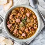This Spicy Lentil Soup makes for a simple and hearty dinner. Full of healthy ingredients, it's an easy recipe that will keep you full and warm all season long (freezer friendly, gluten free) #mealprep #lentils #leftoverham #lentilsoup #spicysoup
