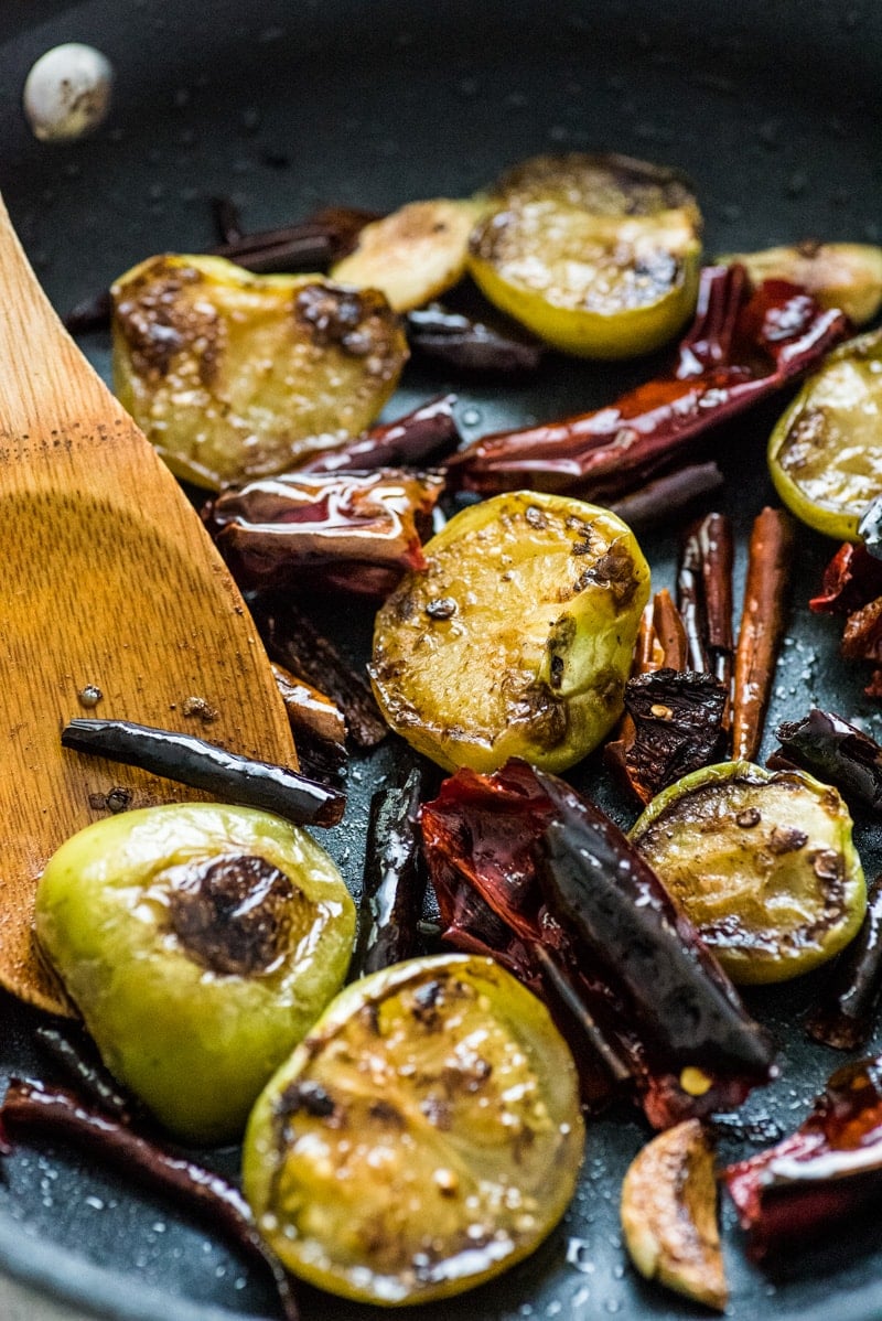 This Toasted Red Chile Salsa made with dried Arbol and New Mexico chiles, tomatillos and garlic is easy to make and perfectly spicy. Add to eggs, tacos and more!