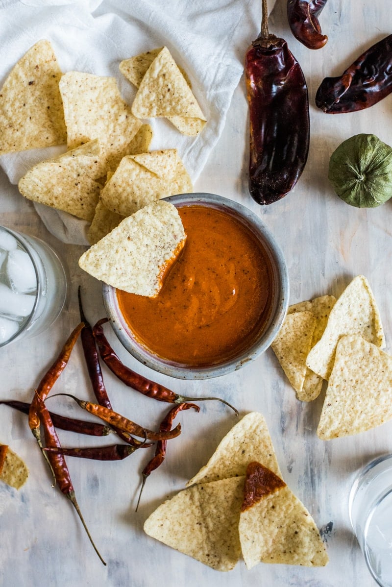 This Toasted Red Chile Salsa made with dried Arbol and New Mexico chiles, tomatillos and garlic is easy to make and perfectly spicy. Add to eggs, tacos and more!