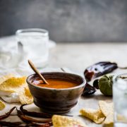 This Toasted Red Chile Salsa made with dried Arbol and New Mexico chiles, tomatillos and garlic is easy to make and perfectly spicy. Add to eggs, tacos and more!