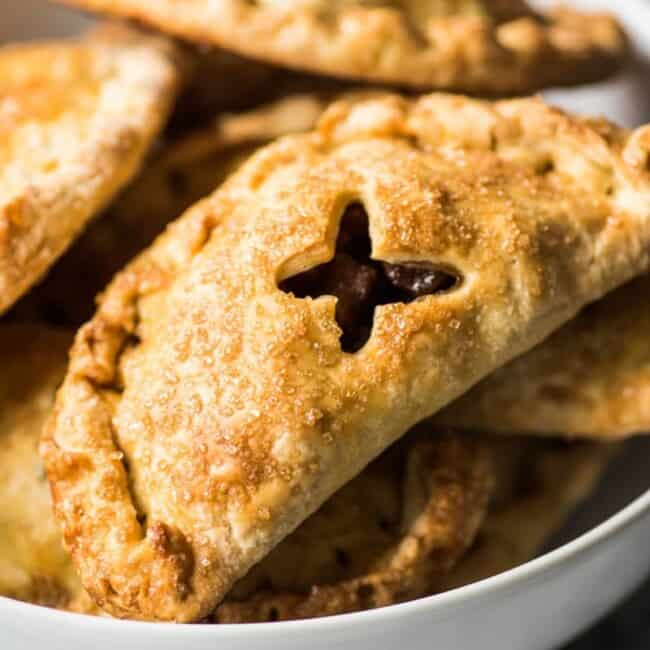 Baked Apple Empanadas are the perfect dessert for the fall and winter seasons! They're portable, delicious and super addicting.