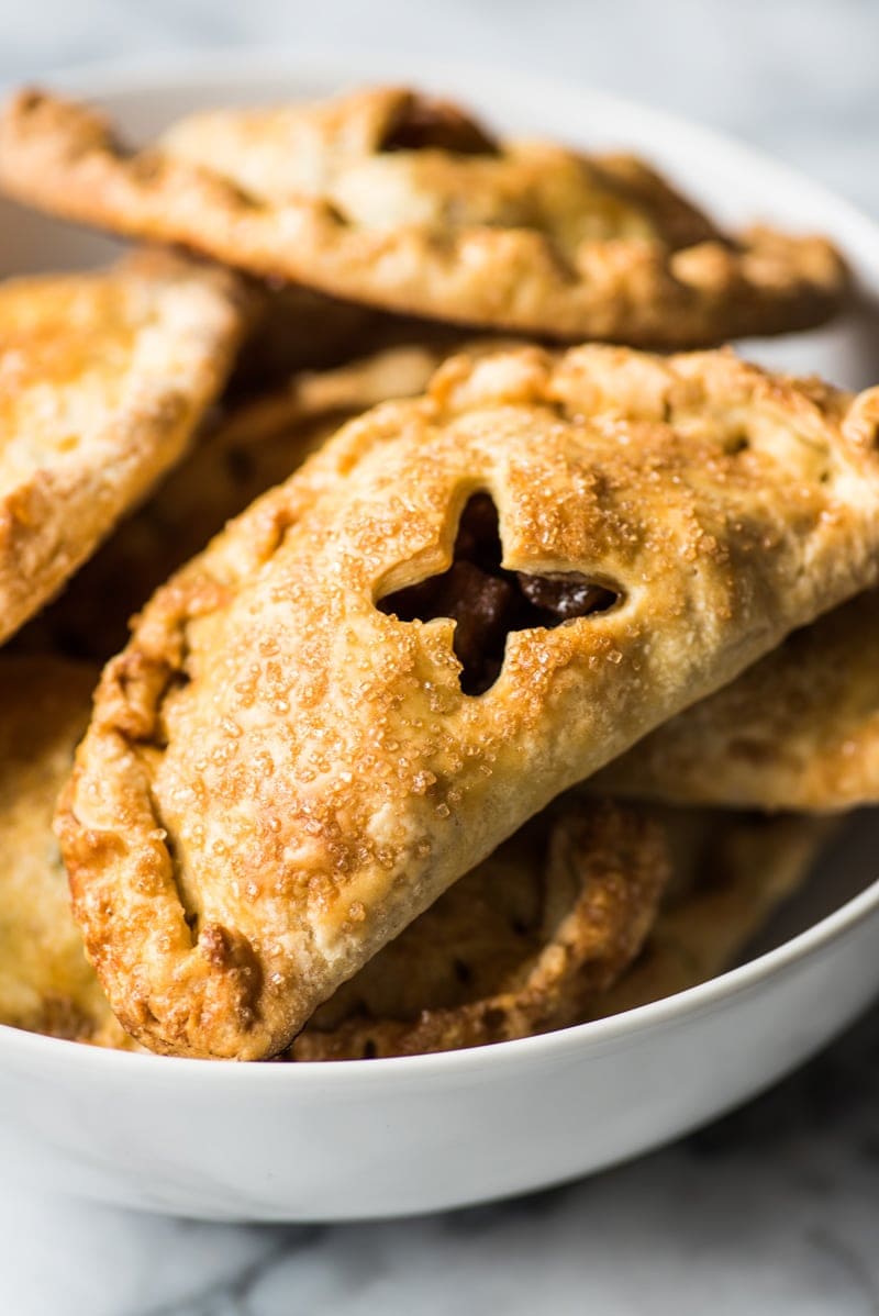 Baked Apple Empanadas are the perfect dessert for the fall and winter seasons! They're portable, delicious and super addicting.