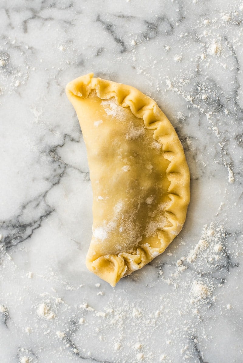 Baked Apple Empanadas are the perfect dessert for the fall and winter seasons! They're portable, delicious and super addicting.